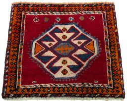 Surface texture of 2000s Shiraz rug with natural Wool and intricate pattern