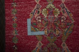 Backside of handmade 2000s Shiraz rug showing knot structure and weave density