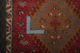 Backside of handmade 2000s Shiraz rug showing knot structure and weave density