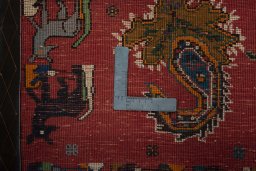 Backside of handmade 2000s Shiraz rug showing knot structure and weave density