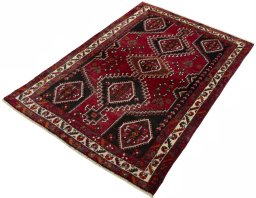 Corner detail of 2000s Shiraz rug showing border pattern and Wool pile