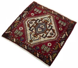 Corner detail of 2000s Shiraz rug showing border pattern and Wool pile