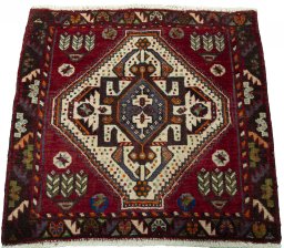 Surface texture of 2000s Shiraz rug with natural Wool and intricate pattern