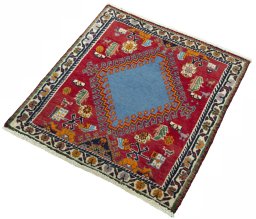 Corner detail of 2000s Shiraz rug showing border pattern and Wool pile