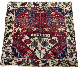 Surface texture of 2000s Shiraz rug with natural Wool and intricate pattern