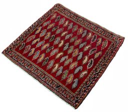 Corner detail of 2000s Shiraz rug showing border pattern and Wool pile