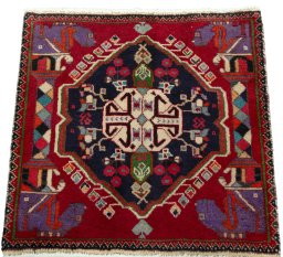 Surface texture of 2000s Shiraz rug with natural Wool and intricate pattern