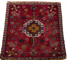 Surface texture of 2000s Shiraz rug with natural Wool and intricate pattern