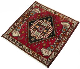 Corner detail of 2000s Shiraz rug showing border pattern and Wool pile