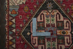 Backside of handmade 2000s Shiraz rug showing knot structure and weave density