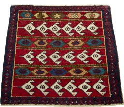 Surface texture of 2000s Shiraz rug with natural Wool and intricate pattern