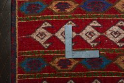 Backside of handmade 2000s Shiraz rug showing knot structure and weave density