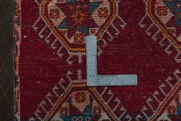 Backside of handmade 2000s Shiraz rug showing knot structure and weave density