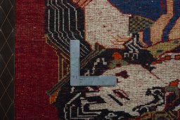 Backside of handmade 2000s Shiraz rug showing knot structure and weave density