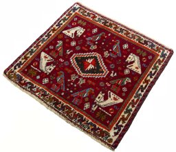 Corner detail of 2000s Shiraz rug showing border pattern and Wool pile