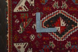 Backside of handmade 2000s Shiraz rug showing knot structure and weave density