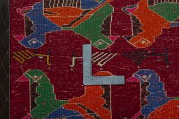 Backside of handmade 2000s Shiraz rug showing knot structure and weave density