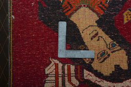 Backside of handmade 2000s Shiraz rug showing knot structure and weave density