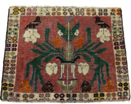 Surface texture of 2000s Shiraz rug with natural Wool and intricate pattern
