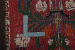 Backside of handmade 2000s Shiraz rug showing knot structure and weave density