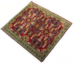 Corner detail of 2000s Shiraz rug showing border pattern and Wool pile