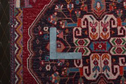Backside of handmade 2000s Shiraz rug showing knot structure and weave density