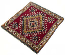 Corner detail of 2000s Shiraz rug showing border pattern and Wool pile