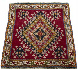 Surface texture of 2000s Shiraz rug with natural Wool and intricate pattern