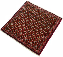 Corner detail of 2000s Shiraz rug showing border pattern and Wool pile