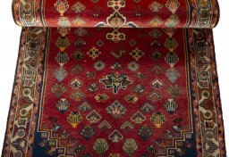 Corner detail of 2000s Shiraz rug showing border pattern and Wool pile