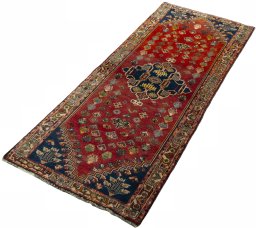 Corner detail of 2000s Shiraz rug showing border pattern and Wool pile