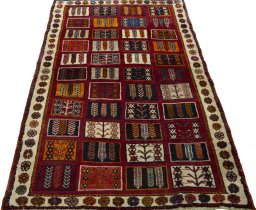 Surface texture of 2000s Shiraz rug with natural Wool and intricate pattern