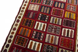 Backside of handmade 2000s Shiraz rug showing knot structure and weave density