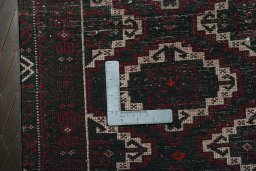 Backside of handmade 2000s Shiraz rug showing knot structure and weave density