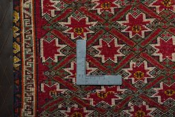 Backside of handmade 2000s Shiraz rug showing knot structure and weave density