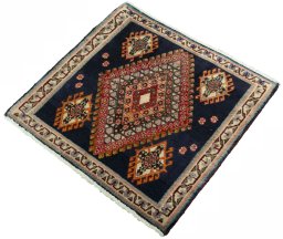 Corner detail of 2000s Shiraz rug showing border pattern and Wool pile