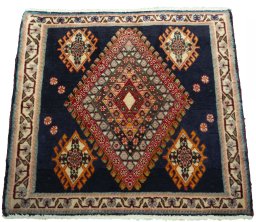 Surface texture of 2000s Shiraz rug with natural Wool and intricate pattern