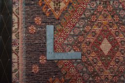 Backside of handmade 2000s Shiraz rug showing knot structure and weave density