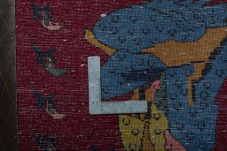 Backside of handmade 2000s Shiraz rug showing knot structure and weave density