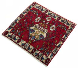 Corner detail of 2000s Shiraz rug showing border pattern and Wool pile