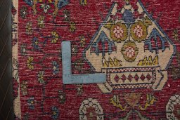 Backside of handmade 2000s Shiraz rug showing knot structure and weave density