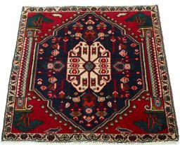 Surface texture of 2000s Shiraz rug with natural Wool and intricate pattern