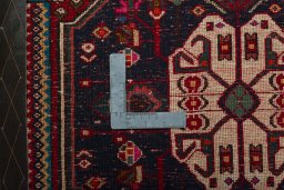 Backside of handmade 2000s Shiraz rug showing knot structure and weave density