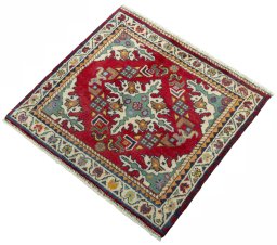 Corner detail of 2000s Shiraz rug showing border pattern and Wool pile