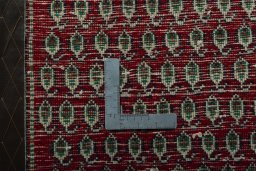 Backside of handmade 2000s Shiraz rug showing knot structure and weave density