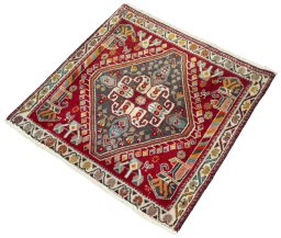 Corner detail of 2000s Shiraz rug showing border pattern and Wool pile