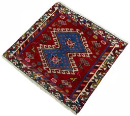 Corner detail of 2000s Shiraz rug showing border pattern and Wool pile