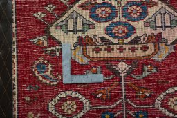Backside of handmade 2000s Shiraz rug showing knot structure and weave density