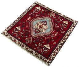 Corner detail of 2000s Shiraz rug showing border pattern and Wool pile