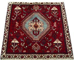 Surface texture of 2000s Shiraz rug with natural Wool and intricate pattern